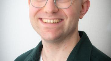 A headshot of Dr Alex Browne